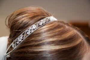 bridal hair accessory tips - silver veil headband sitting on a bun