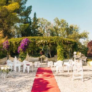 Micro Wedding - small ceremony set up with red carpet and 6 chairs - Wedding Trends 2021